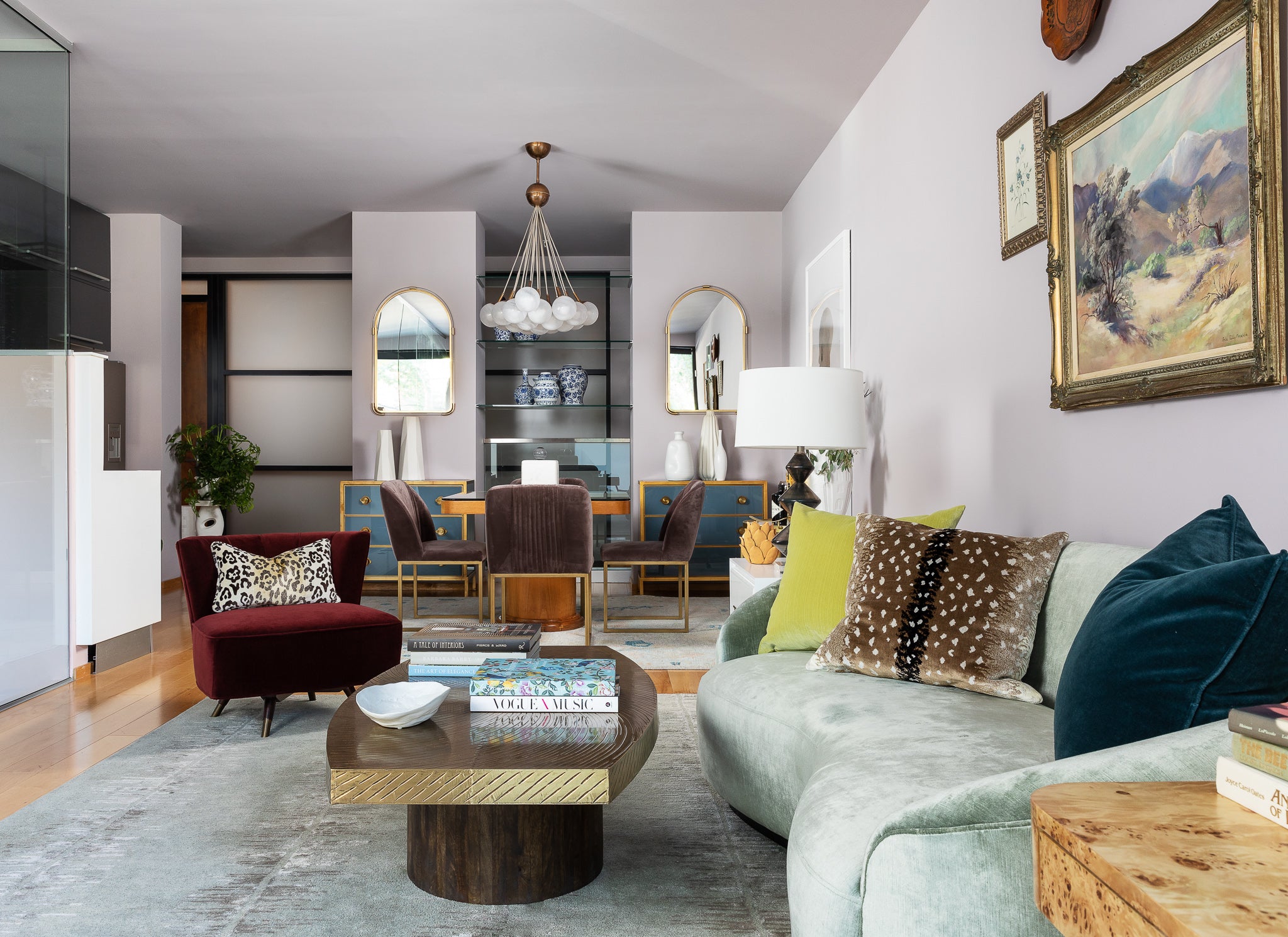 A living area by Lisa & Leroy, featuring luxe textures and a mix of soft and bold tones.
