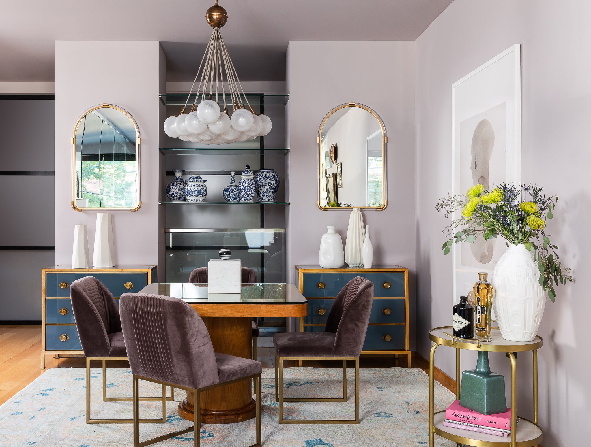 A dining area featuring soft violets and deep blues, by Lisa & Leroy.