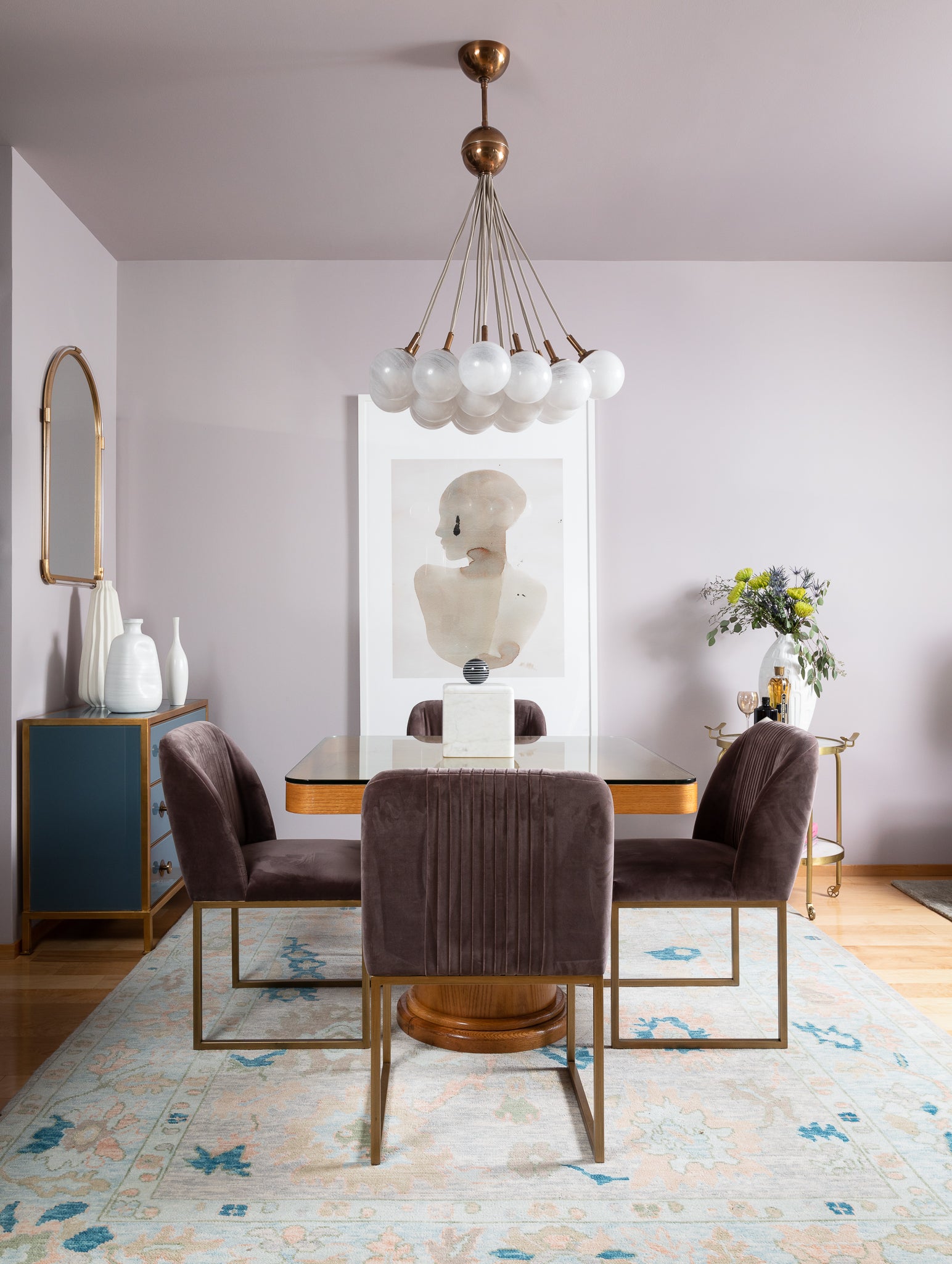 A dining area featuring soft violets and deep blues, by Lisa & Leroy.