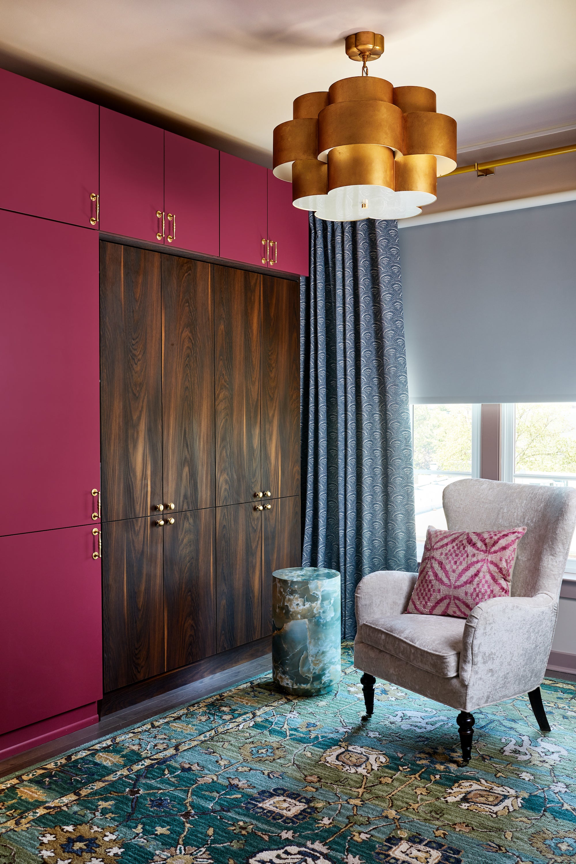 Custom cabinetry in warm wood tones and saturated pinks by Lisa & Leroy.
