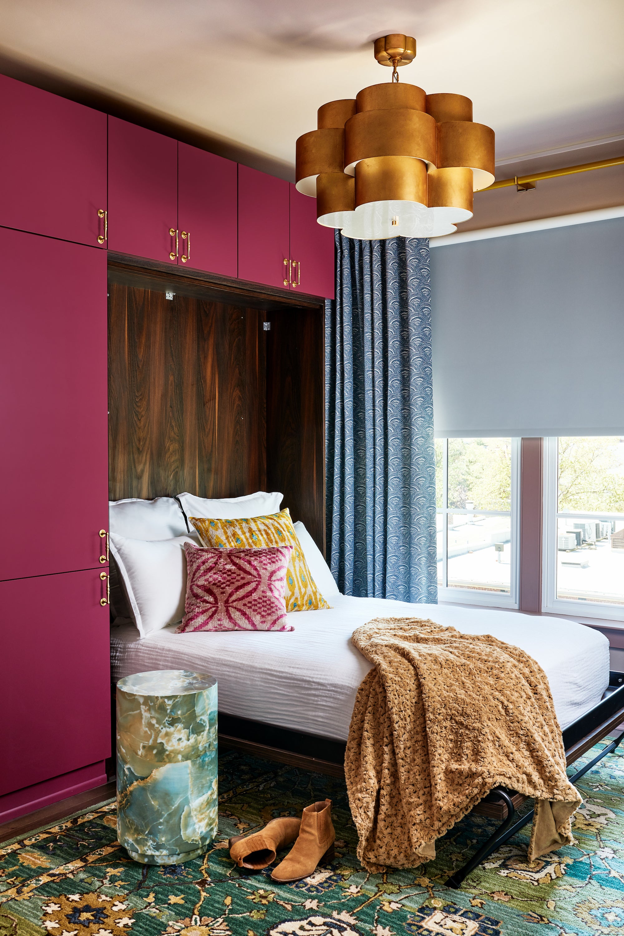 A custom Murphy bed in a jewel-toned living area by Lisa & Leroy.