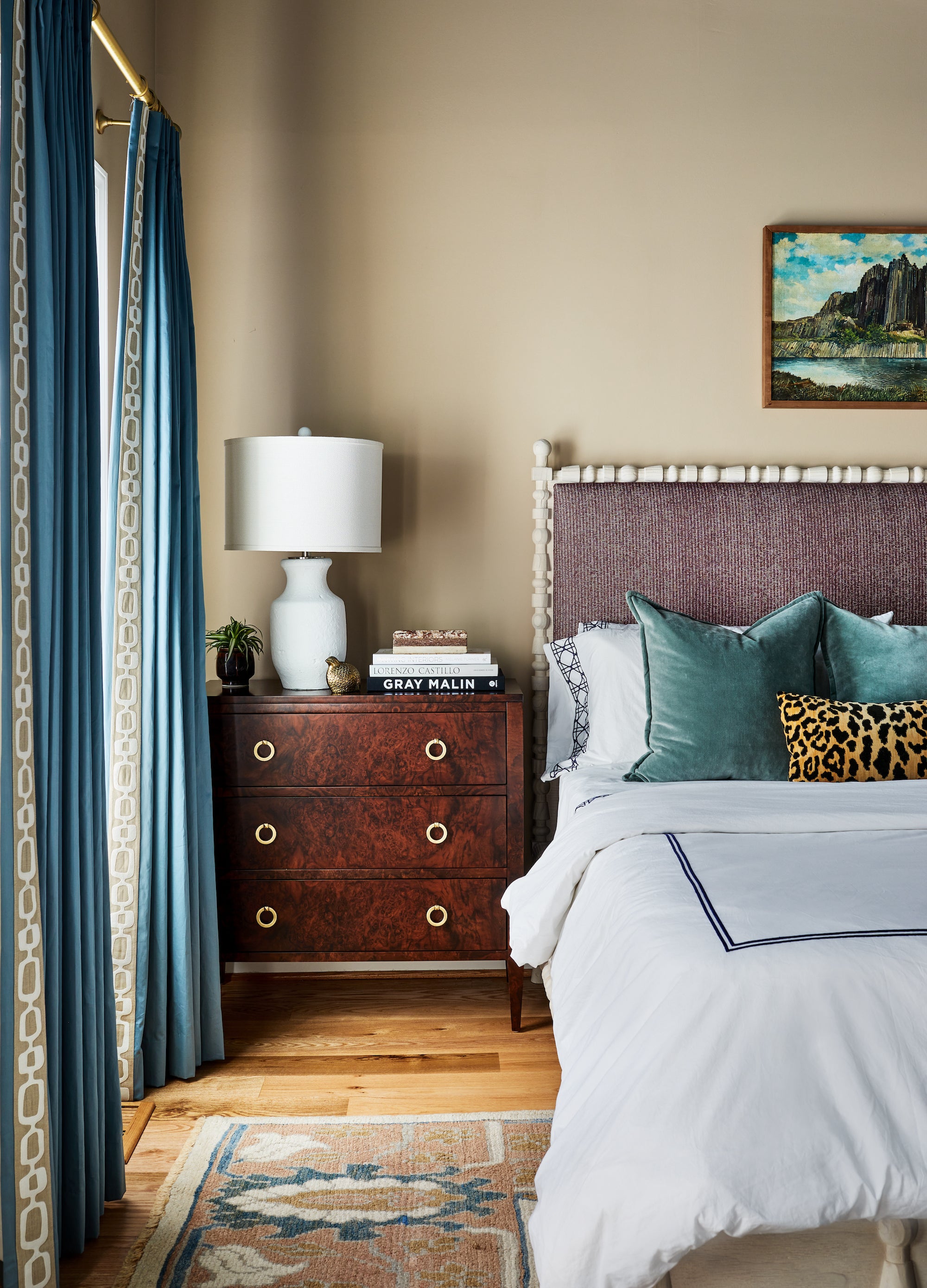 A layered bedroom of blues and plums by Lisa & Leroy.