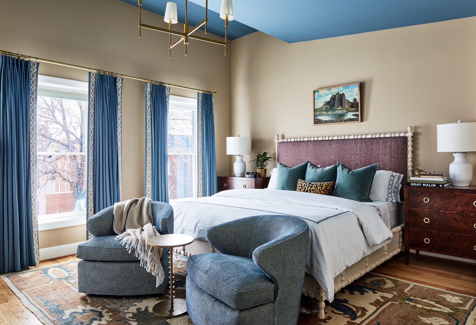 A layered bedroom of blues and plums by Lisa & Leroy.
