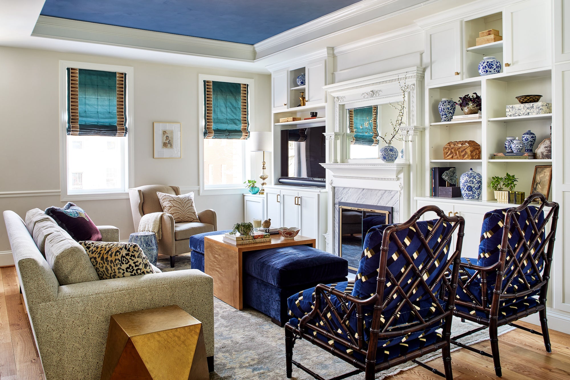 Classic meets eclectic in this living area by Lisa & Leroy, with elements of rich blue.