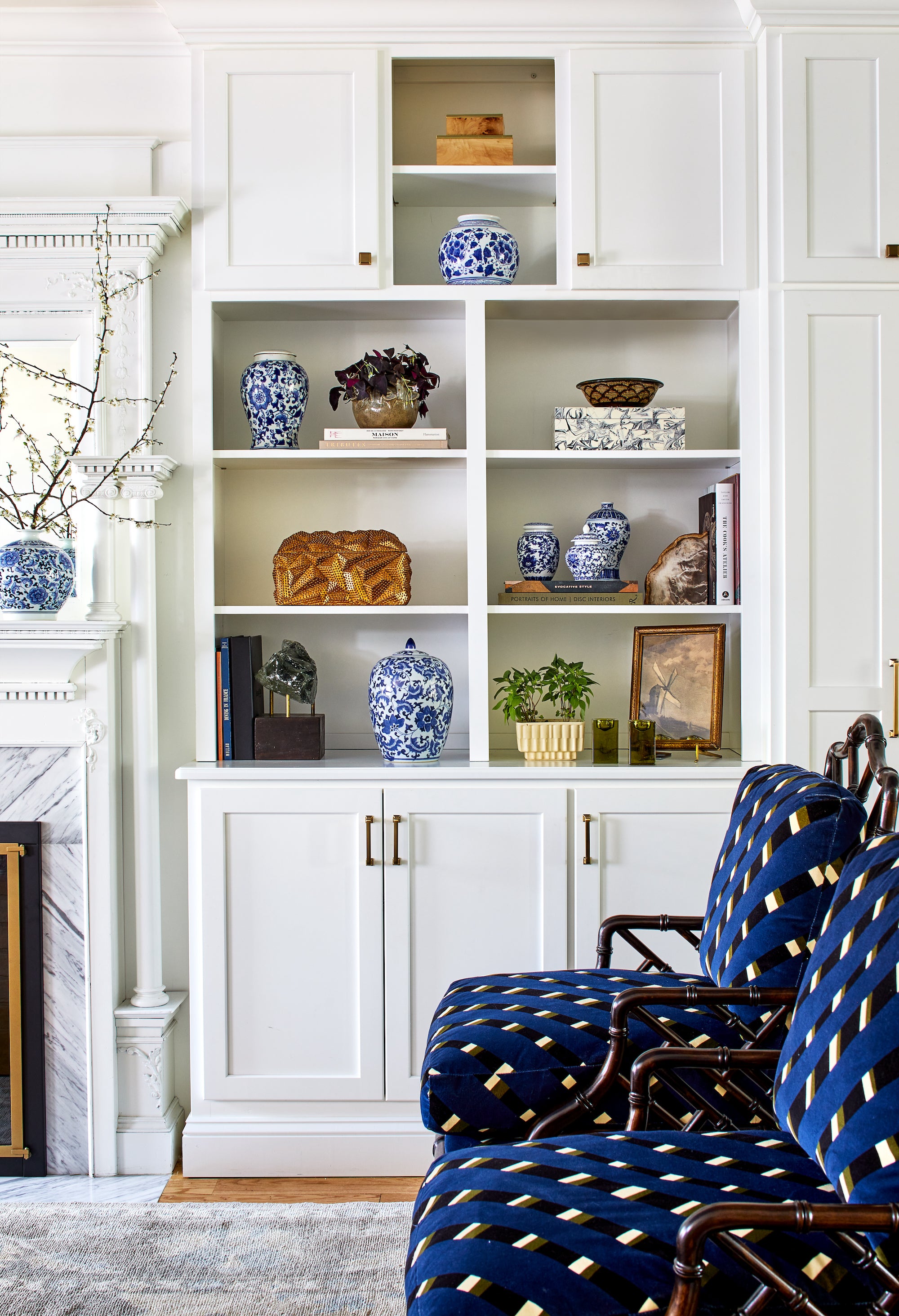 Classic meets eclectic in this living area by Lisa & Leroy, with elements of rich blue.