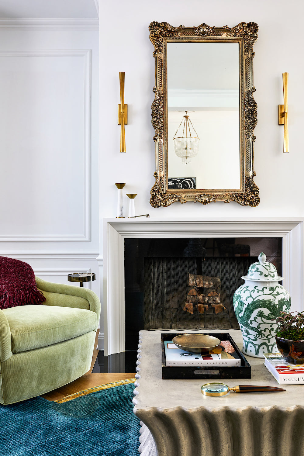 A living area featuring old and new pieces and an original fireplace by Lisa & Leroy.