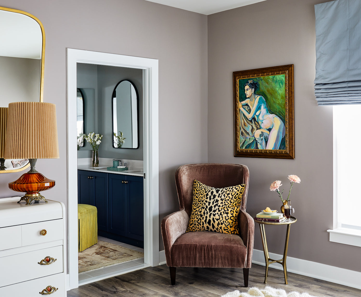 A layered and neutral bedroom with accents of animal print and chartreuse by Lisa & Leroy.